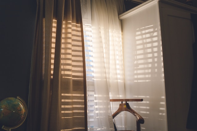 blinds and curtains in a dark room